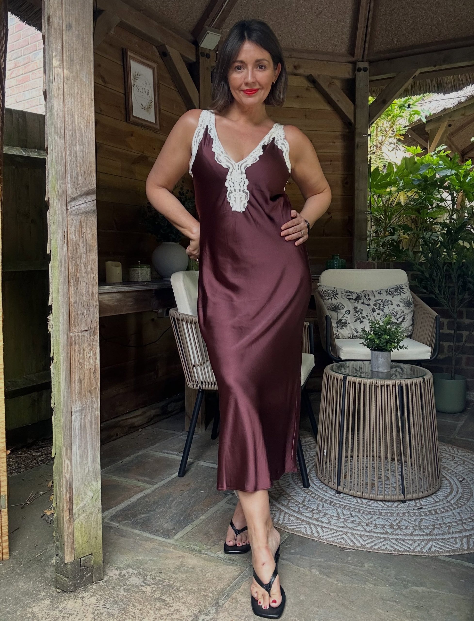 A Burgundy Satin Dress with Lace Trim for Easy Evening Style